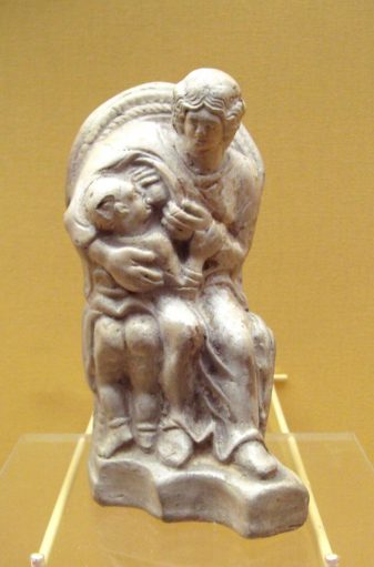 a statue of Matrona showing her breastfeeding a small child.