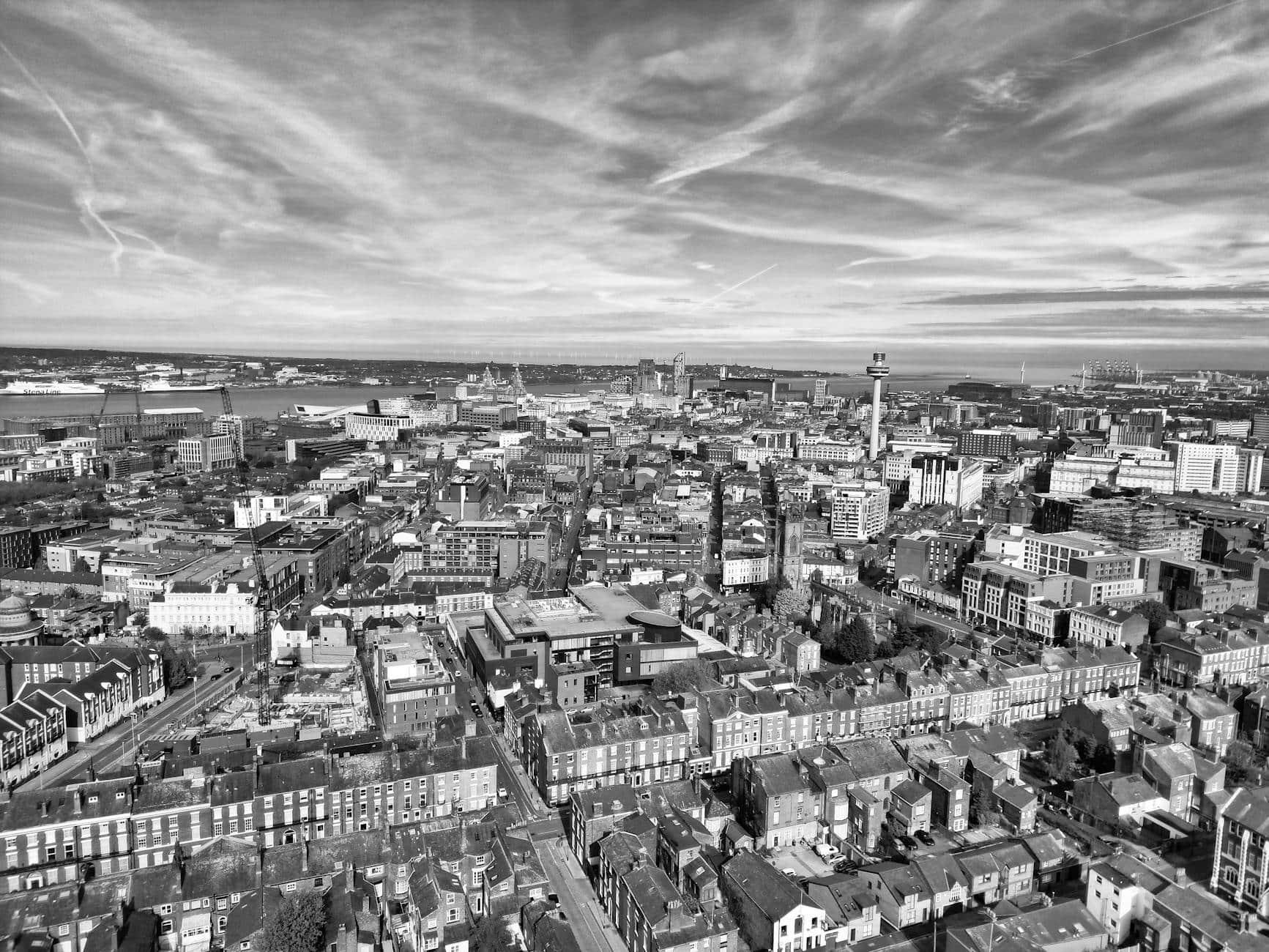 Image shows a black and white arial image of the Liverpool skyline highlighting that local magic is everywhere.